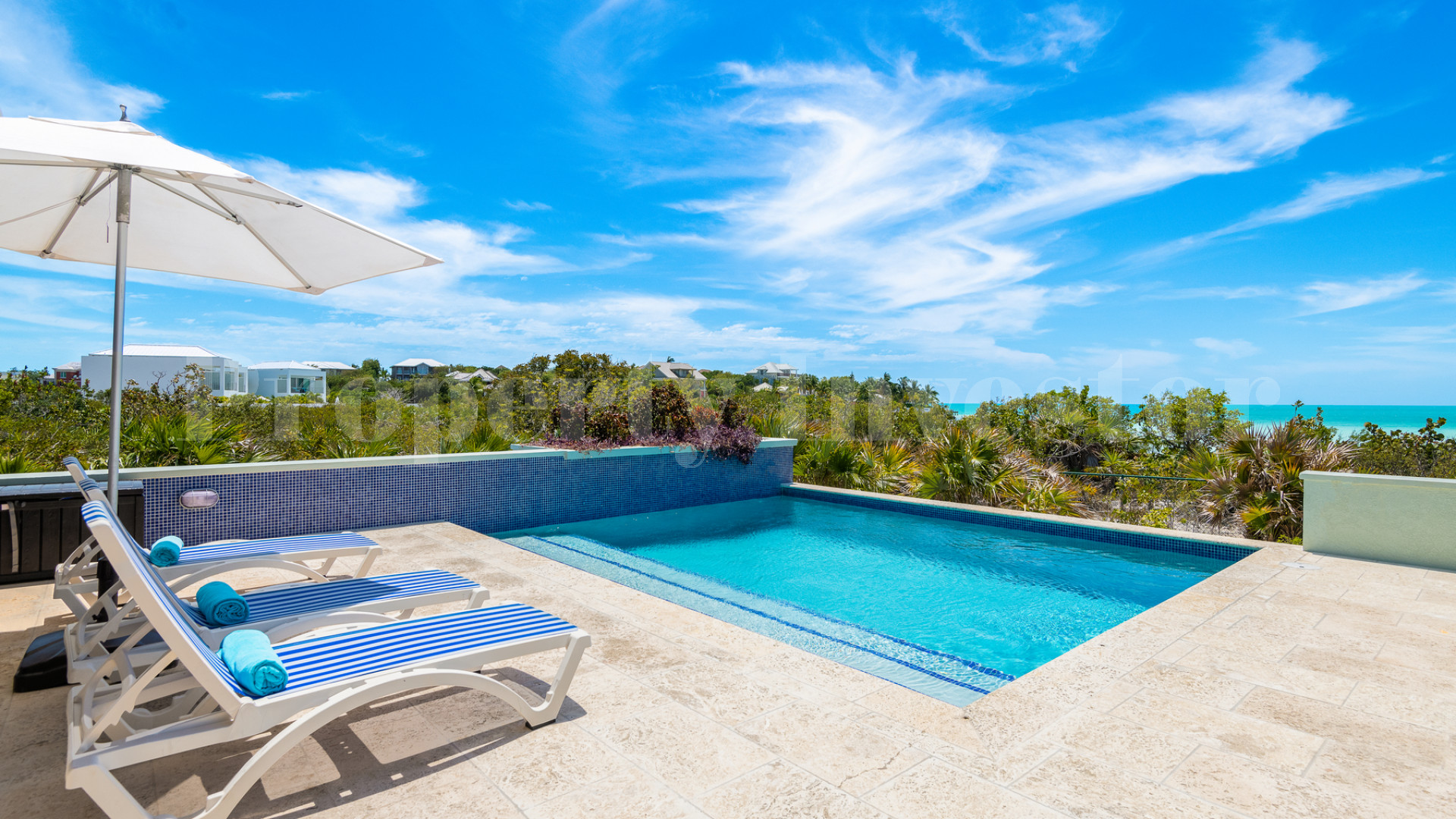 Fantastic 4 Bedroom Cape Cod Style Luxury Beach House for Sale  on Taylor Bay Beach, Turks & Caicos