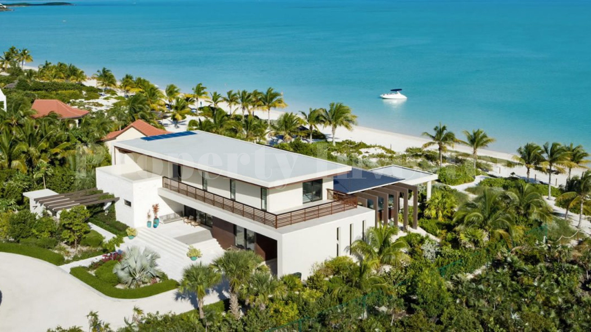 Изысканный роскошный дом на 7 спален на пляже в Тёркс и Кайкос