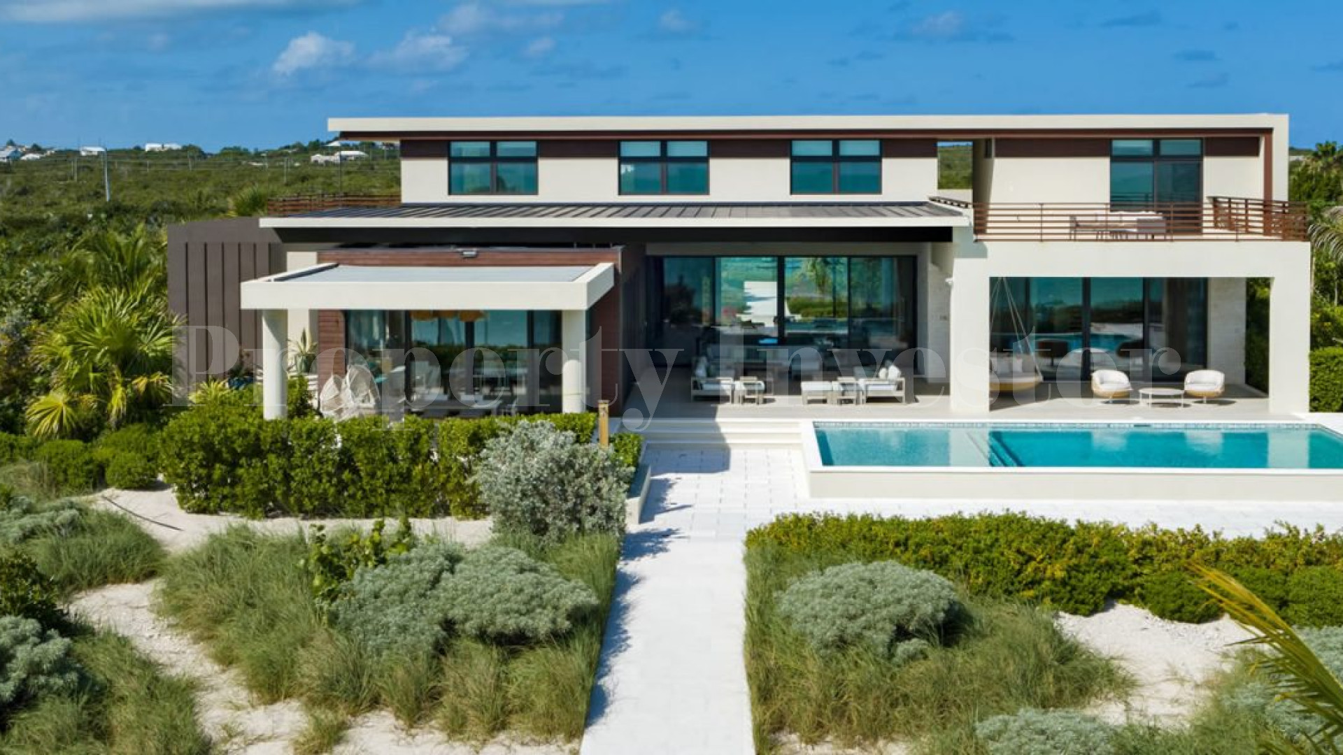 Изысканный роскошный дом на 7 спален на пляже в Тёркс и Кайкос