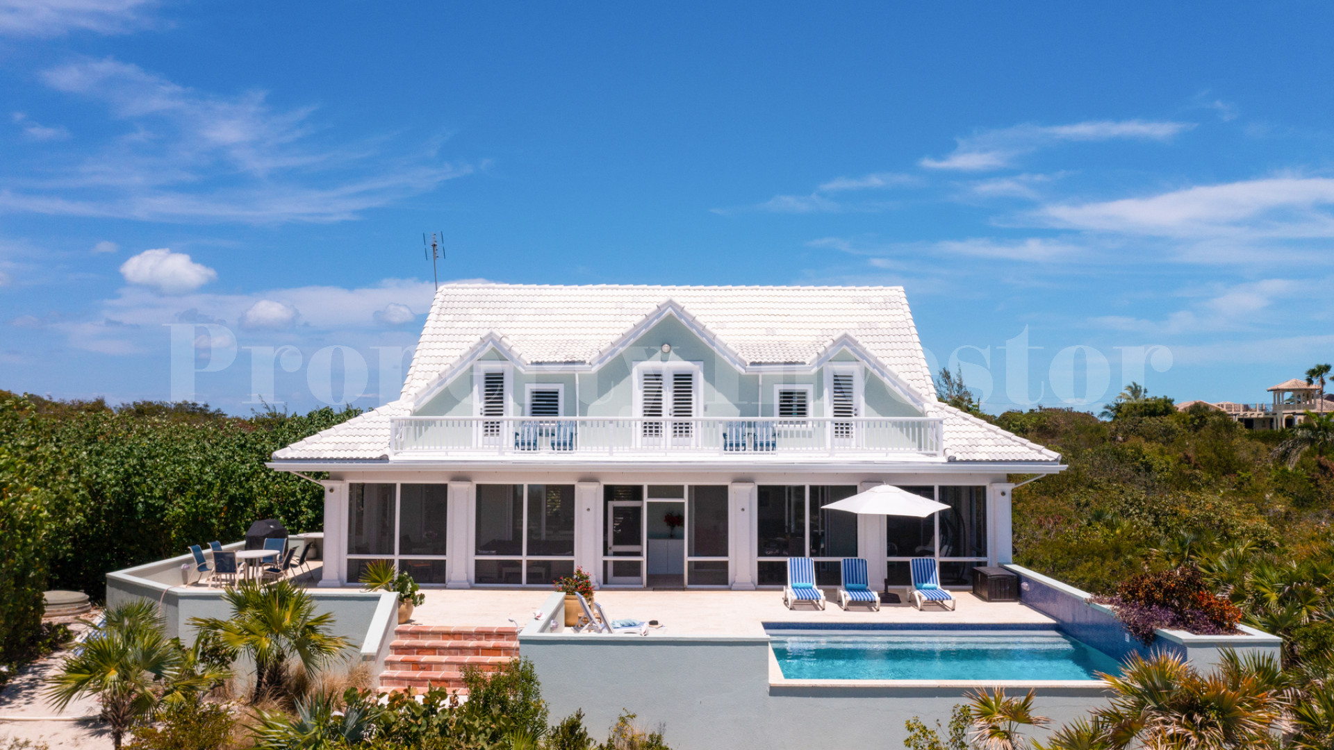Fantastic 4 Bedroom Cape Cod Style Luxury Beach House for Sale  on Taylor Bay Beach, Turks & Caicos